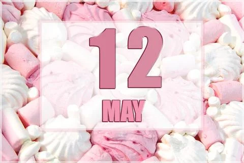 Calendar date on the background of white and pink marshmallows. May 12 is the Stock Photos