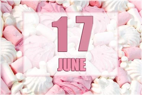 Calendar date on the background of white and pink marshmallows. June 17 is th Stock Photos