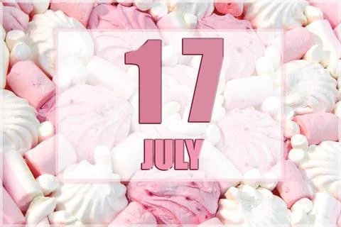Calendar date on the background of white and pink marshmallows. July 17 is th Stock Photos