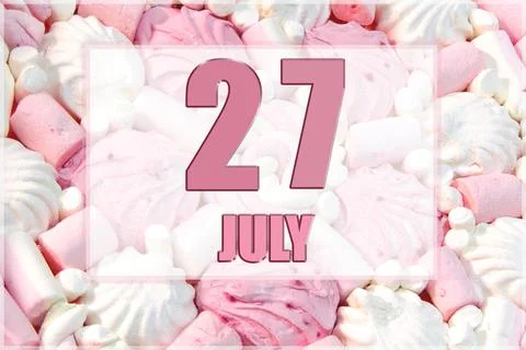Calendar date on the background of white and pink marshmallows. July 27 is th Stock Photos
