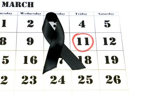 Calendar with marked day of terrorist attacks and black tie 스톡 사진