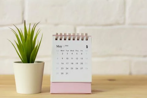The calendar for May 2022 is on the table. Stock Photos