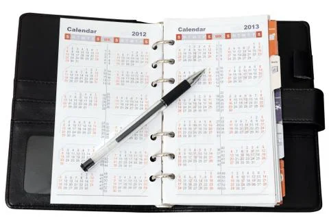 Calendar in notebook with pen Stock Photos
