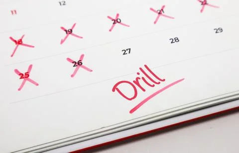 A calendar page featuring Drill written in red, highlighting an important s.. Stock Photos