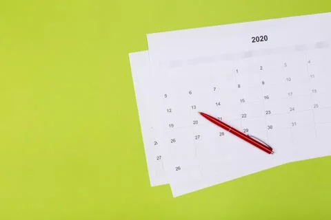 Calendar on the table with green background, planning a business meeting or t Stock Photos