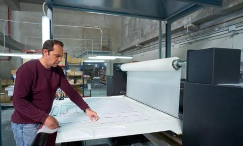 Calender transfer machine production operator man Stock Photos