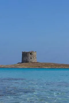 Caletta della Torre beautiful view of ruined tower on la pelosa beach sardinia Stock Photos