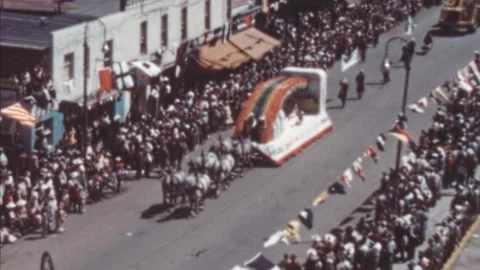 Calgary - 1948: Float shaped like a rainbow passes by at 40s Stampede Parade Stock Footage 290070892