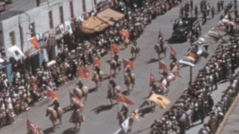 Calgary, Canada - 1949: Crowds line the street during the annual Stampede Parade Stock Footage 288980503