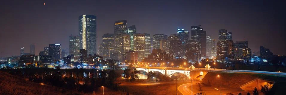 Calgary downtown cityscape with skyscraper and bridge at night, Canada. Stock Photos