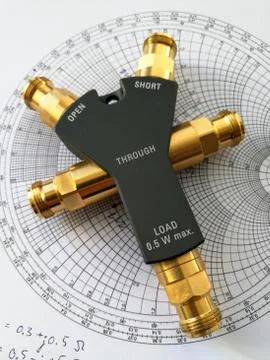 Calibration kit for RF VNA in front of Smith chart Foto stock