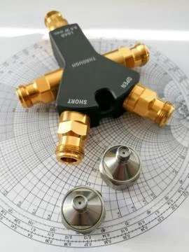 Calibration kit for RF VNA in front of Smith chart Foto stock