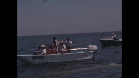 CALIFORNIA - 1963 - NASA technicians use binoculars from small boats to observe 스톡 동영상 325206635