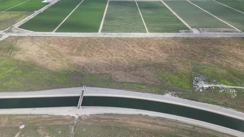 California Aqueduct and Large Scale Farmland Drone Aerial Footage Stock Footage 335400593