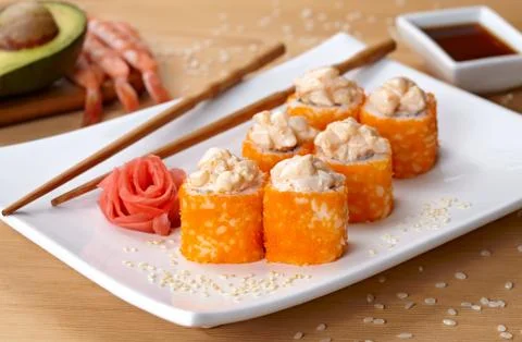 California deluxe sushi roll with tobiko caviar and spice Stock Photos