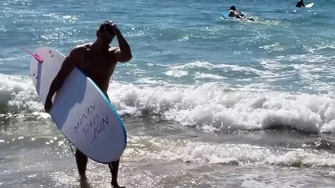 California Sun Surfers Stock Footage