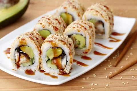 California sushi roll with eel, avocado and cucumber Stock Photos