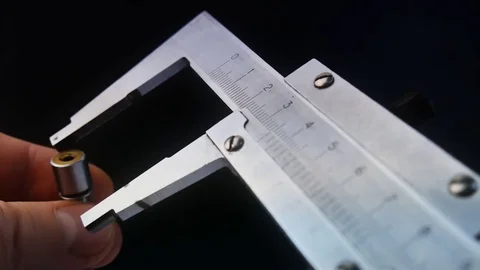 Caliper Measuring. TO PRECISELY MEASURE THE DIAMETER Stock Footage 71655109