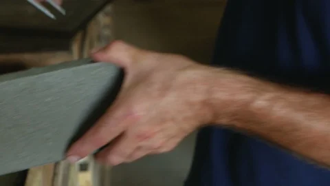 Calipers or trammel measures the dimensions of the concrete paver for road Stock Footage 95434910