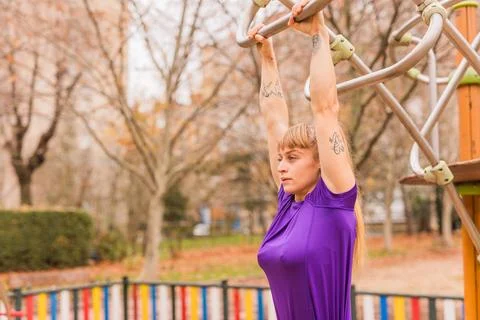 Calisthenics pull- up back exercise for cross fitness workout. Hispanic mid Stock Photos