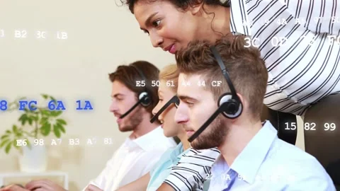 Call agents typing as supervisor leaning pointing for help, code overlay Stock Footage 333595000