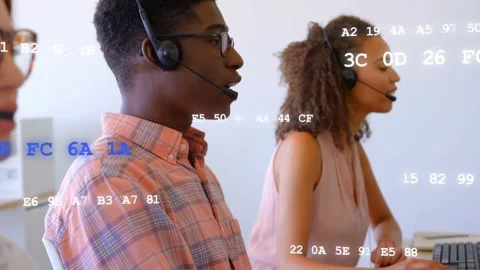 Call arriving, male rep adjusting headset and speaking, female typing, code Stock Footage 333720119