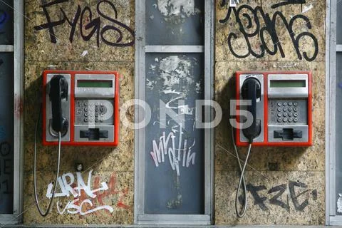 Call Box, Two Telephones On The Wall Covered With Graffiti