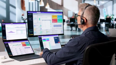Call Center Agent Monitors Customer Support Dashboard Video stock 345857838
