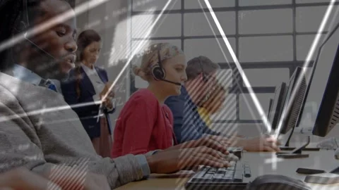 Call-center agents typing at keys while colleague checking device initiating Vidéo 333019667