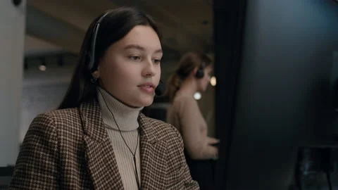 Call center and helpful customer service. Use pc computer and answer questions o Stock Footage 199483165