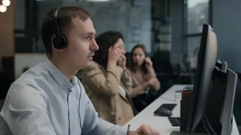 Call center and helpful customer service. Use pc computer and answer questions o Stock Footage 199483192