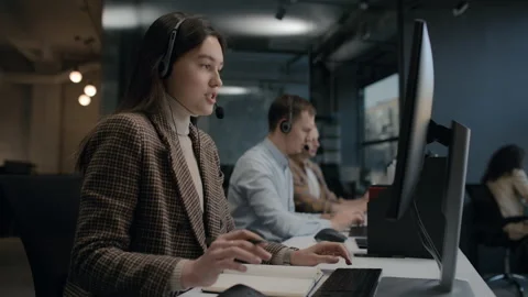 Call center and helpful customer service. Use desktop pc at computer table and p Stock Footage 199483368