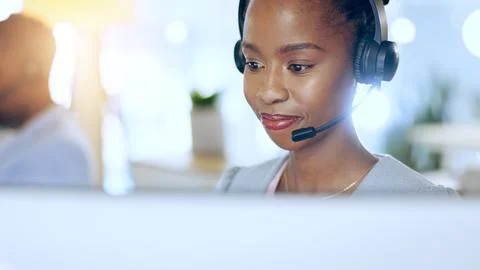 Call center, computer and black woman in telemarketing, support or contact us at Stock Photos