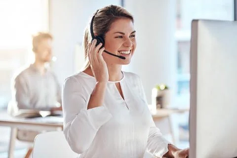 Call center, computer and friendly with woman in office for customer service Stock Photos