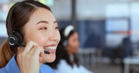 Call center, customer support and sales with an asian woman consultant working Stock Photos