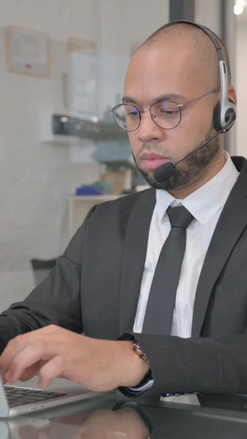 Call Center Employee with Headset Working in Office, vertical video Video stock 325568324