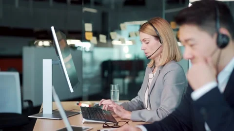 Call center employee provide help to client distantly. Asian male customer  Stock Footage 169366500