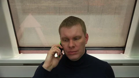 A call center employee talking on two phones at the same time Stock Footage 100152995