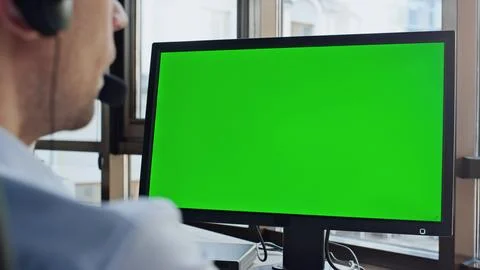 Call center green computer screen closeup. Man service operator talking customer Stockfoto's