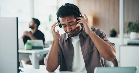 Call center, headache and man in office with headset, frustration or stress with Stock Footage 329390348
