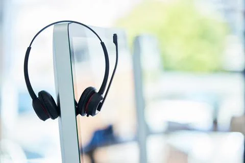 Call center, headset and computer with office background, consulting and Foto stock