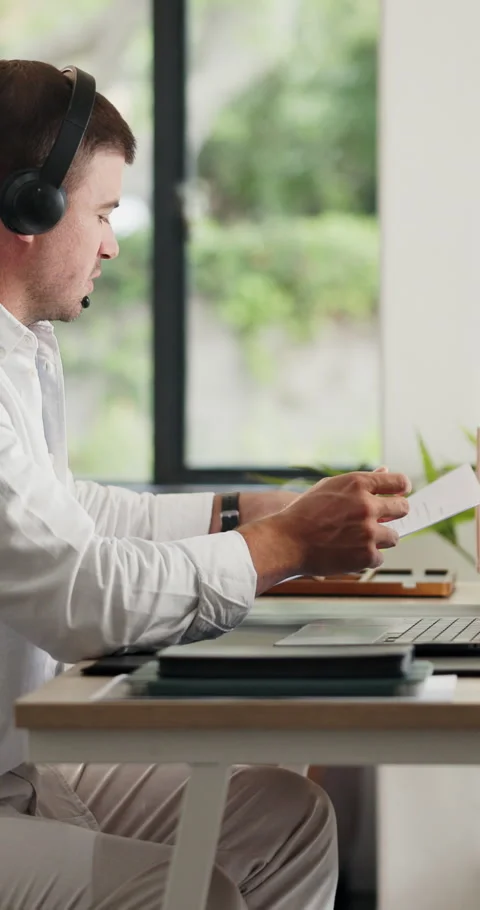 Call center, headset and man in home, documents and advice for customer service, Stock Footage 330923419
