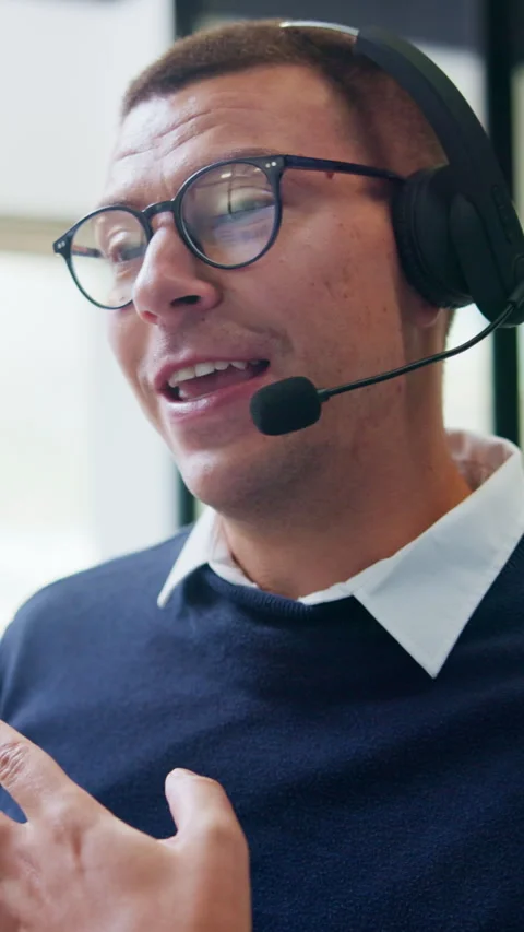 Call center, headset and man with communication, advice or customer support in Stock Footage 335826897