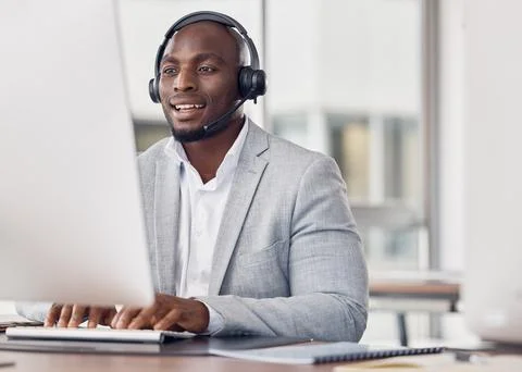 Call center, man and computer for typing with smile, reading and tech support Stock Photos