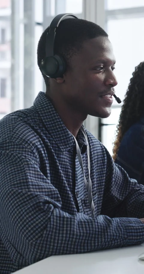 Call center, man and technical support with smile, talk or help desk for Stock Footage 335812760