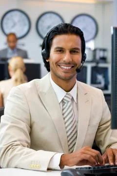 Call center operator in open space office Stock Photos