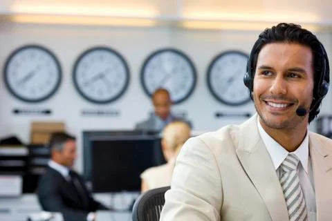 Call center operator in open space office Stock Photos