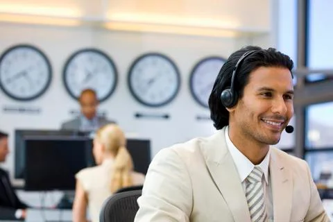 Call center operator in open space office Stock Photos