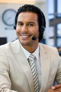Call center operator in open space office Stock Photos