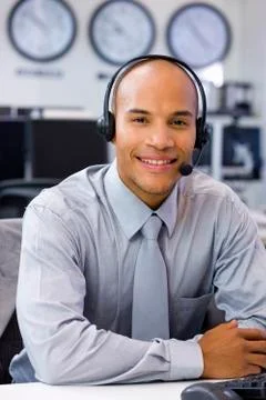 Call center operator in open space office Stock Photos